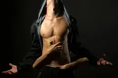 Bare chested man with hands on his body