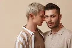 Two gay men with touching heads