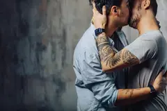Two gay men kissing