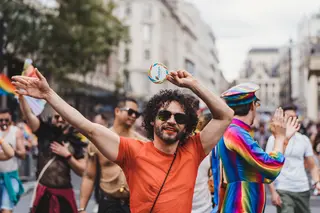 Happy gay man dancing during Pride celebration