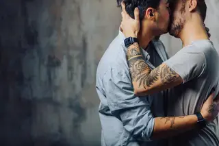 Two gay men kissing