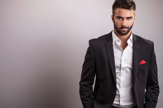 Attractive married gay man in in a suit jacket and shirt