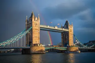 Tower Bridge, London at sunset with rainbow in background after a storm